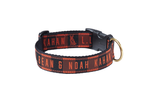 A plaid dog collar with the text "L. L. Bean & Noah Kahan" printed on it.