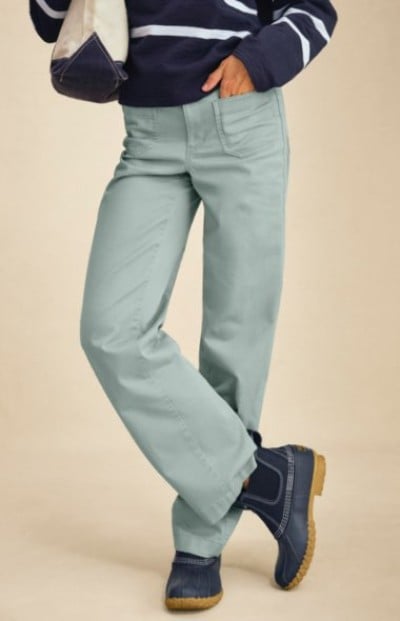 Light green straight‑leg pants paired with a navy striped top and L. L. Bean boots.