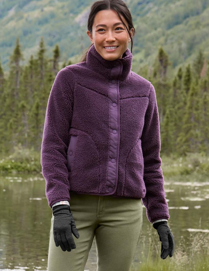 Smiling woman outside wearing a fleece jacket.