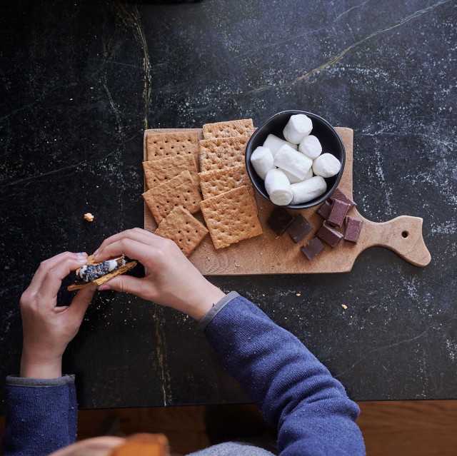 Someone making an indoor s'more.