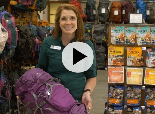 An L. L. Bean Customer Service Rep holding a hiking pack, and a play video symbol.