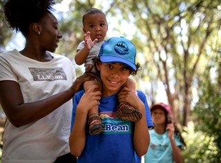 Smiling mom and children outside in L.L. Bean clothing