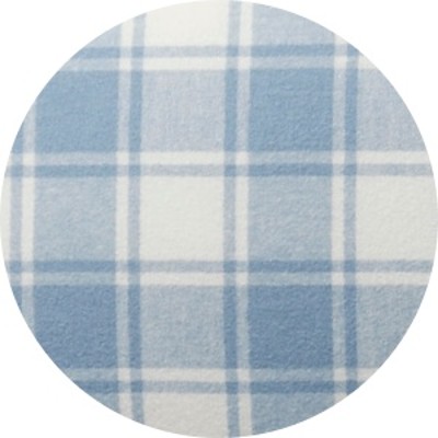 A circular swatch of a blue plaid bed sheet.