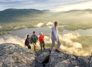 Family hiking in the mountains wearing L.L.Bean clothing.