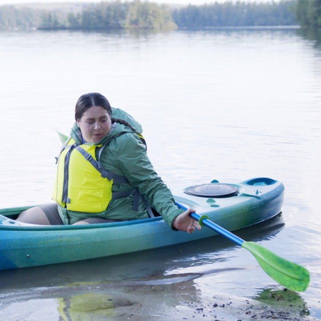 Getting out of your kayak onto a beach.