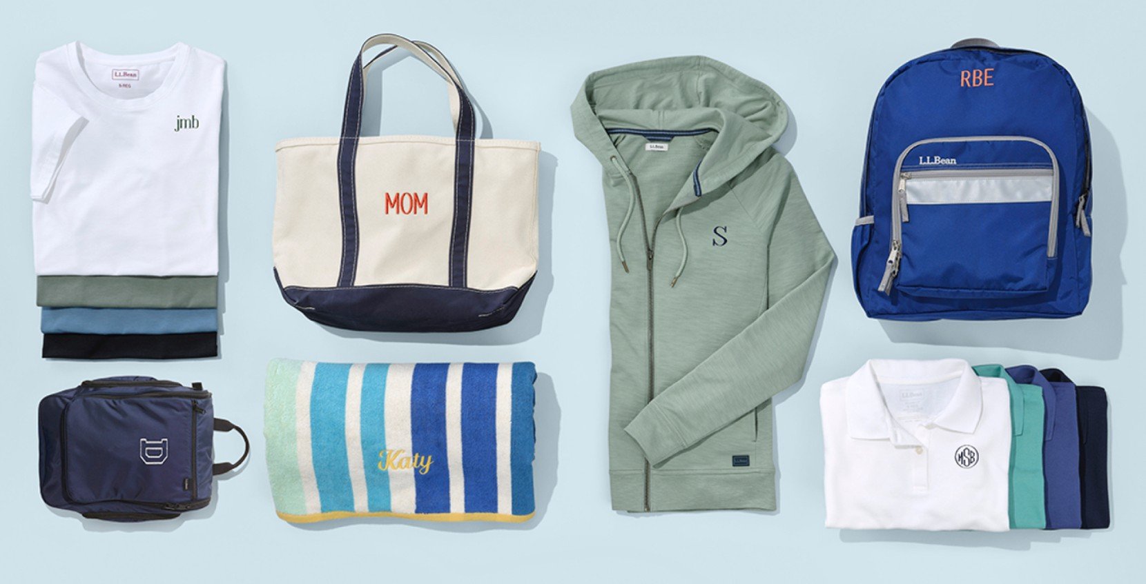 Several monogrammable items including a tote with "Mom", a beach towel, sweatshirt and several shirts.