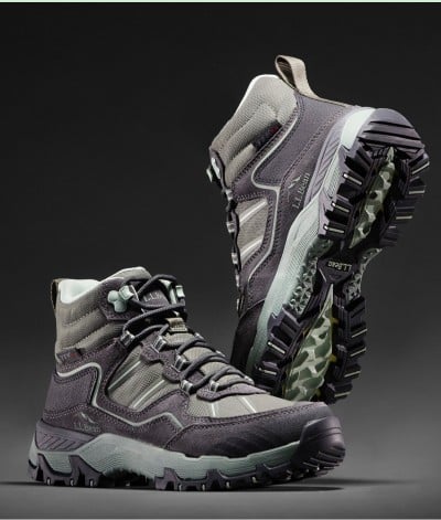 Grey and black L.L.Bean hiking boots with rugged soles, detailed stitching, and laces, shown on a dark background.
