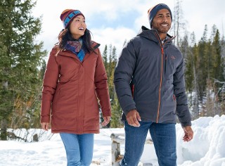 Two people walking outside in winter.