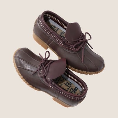 Pair of brown leather duck shoes with tan rubber soles and lace-up fronts.