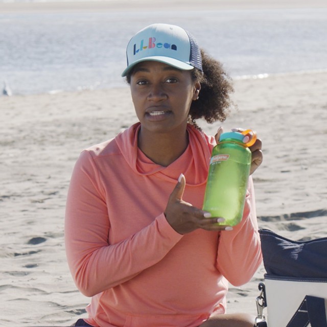 Stephanie holding a full, frozen water bottle.