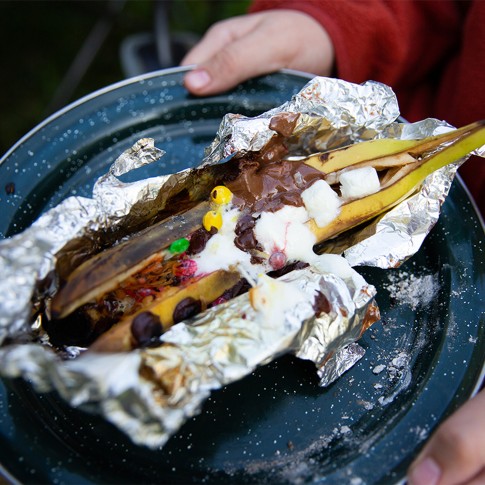 Close-up of a finished banana boat fresh off the camp stove.