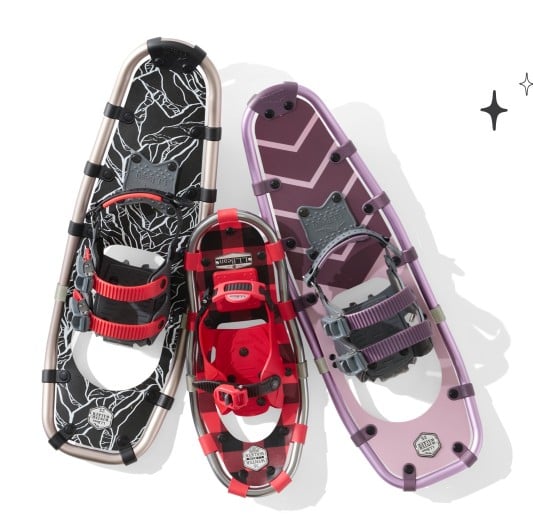 Overhead view of snowshoes in red, black, and purple in various sizes.