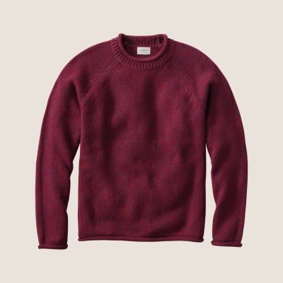 Maroon crewneck sweater with long sleeves and ribbed collar, cuffs, and hem. 